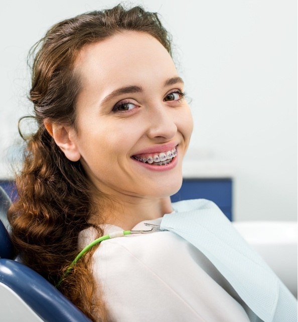 happy-woman-in-braces-smiling-during-examination-i-2021-08-30-01-49-58-utc